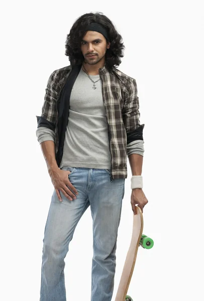 Man holding a skateboard — Stock Photo, Image