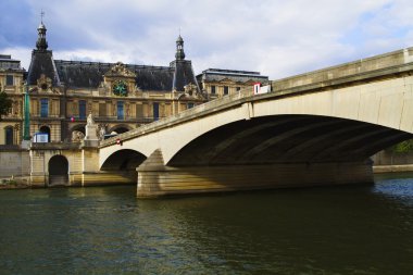 Arch bridge across the river with Luxembourg Palace clipart