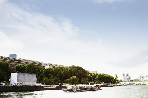 Ferry with a cathedral in the background — Stock Photo, Image