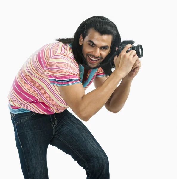 Photographer taking a picture with a digital camera — Stock Photo, Image