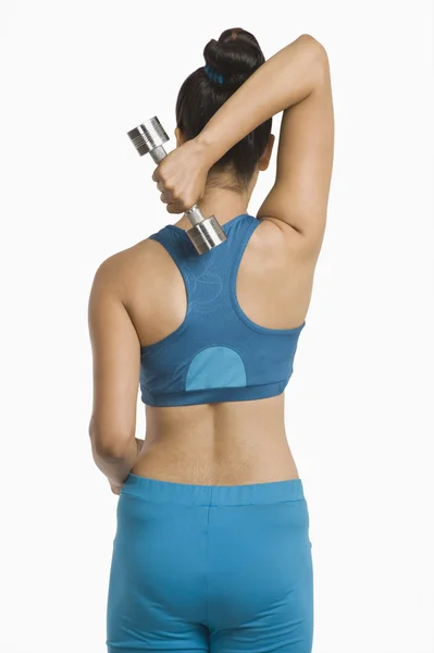 Woman exercising with dumbbells — Stock Photo, Image