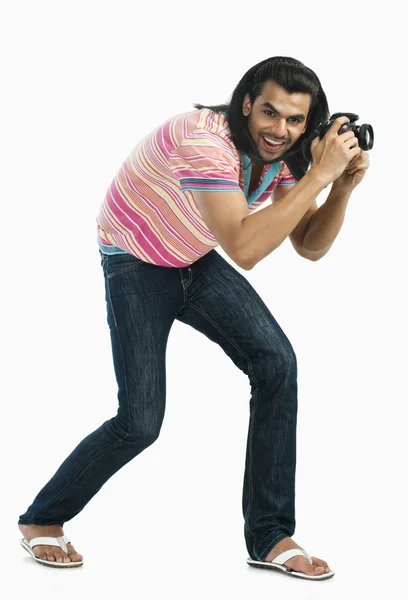 Photographer taking a picture with a digital camera — Stock Photo, Image