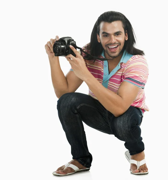 Photographer taking a picture with a digital camera — Stock Photo, Image