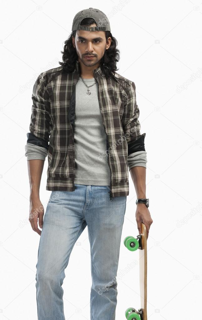 Man holding a skateboard