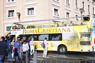 Tourists near a tour bus Roma Cristiana clipart
