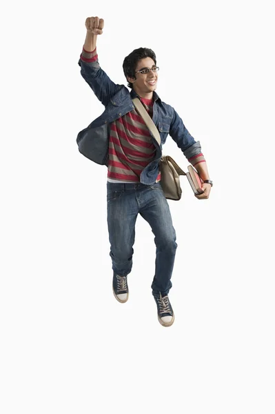 Student jumping in excitement — Stock Photo, Image