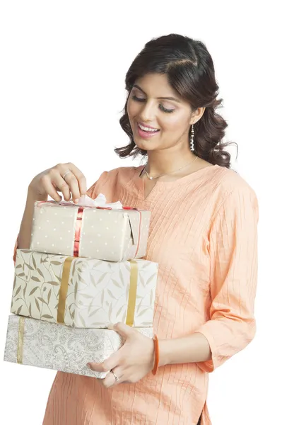 Woman holding gift boxes — Stock Photo, Image