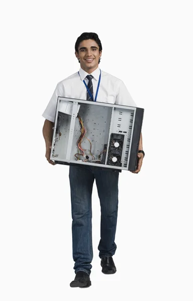 Student carrying a computer cabinet — Stock Photo, Image