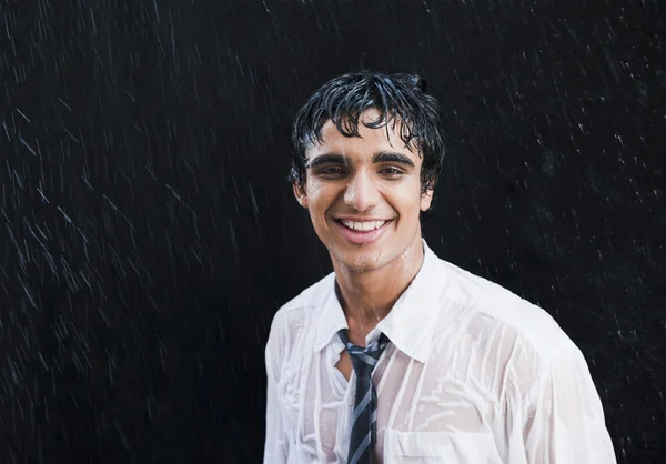Businessman enjoying in the rain — Stock Photo, Image