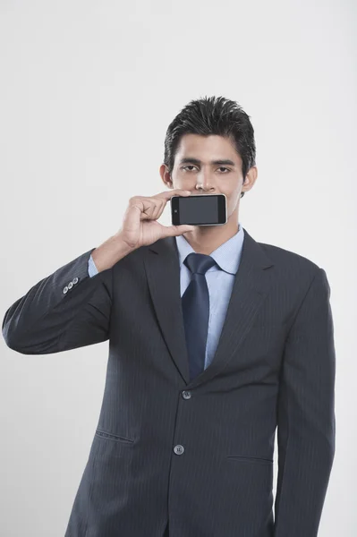 Businessman holding a mobile phone — Stock Photo, Image