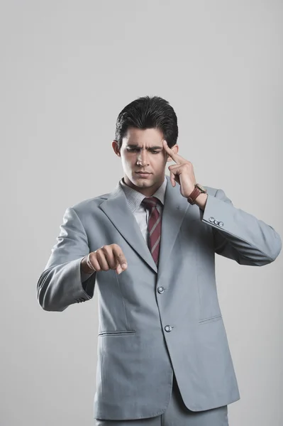 Businessman pointing forward with a finger — Stock Photo, Image