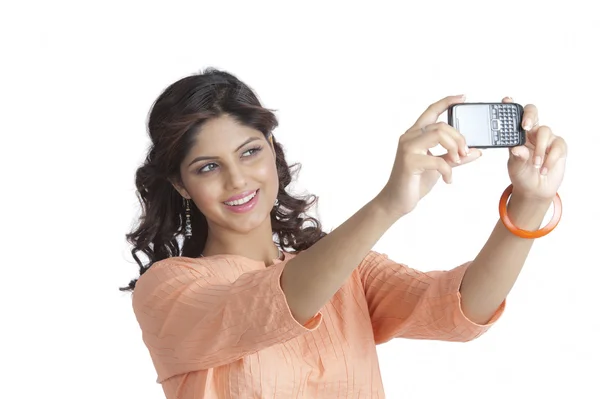 Woman taking a picture of herself — Stock Photo, Image