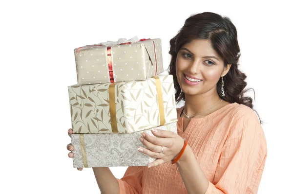Woman holding gift boxes — Stock Photo, Image