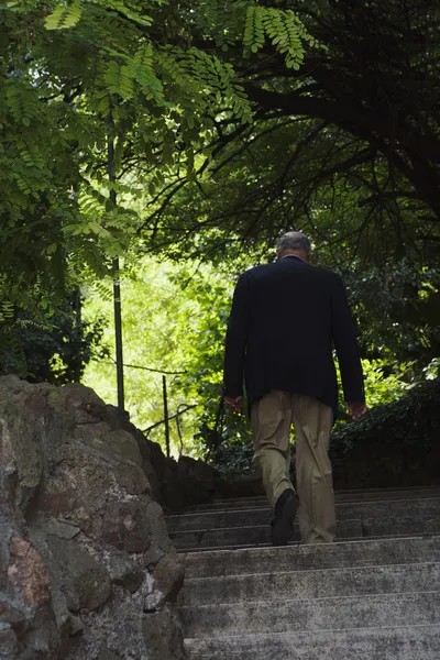 Man moving up steps — Stock Photo, Image