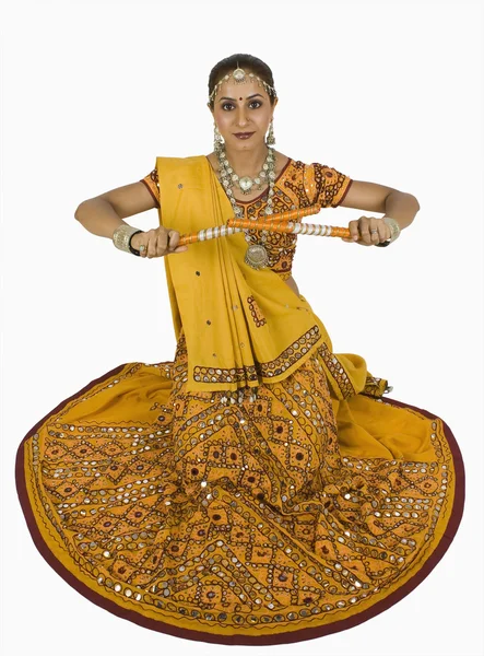 Woman performing dandiya — Stock Photo, Image