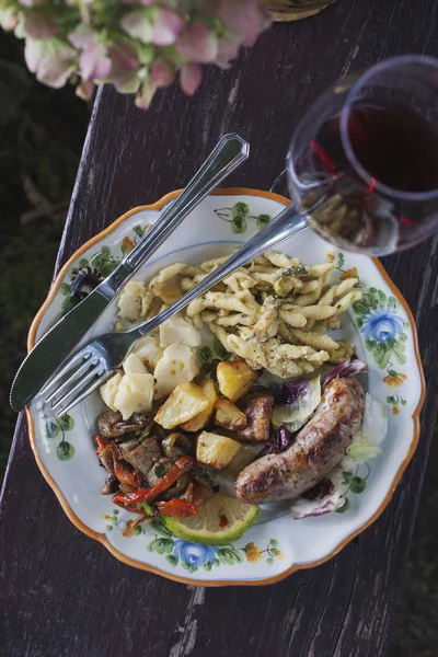 Meal served on a plate with a wineglass — Stock Photo, Image