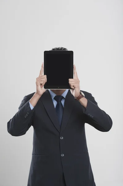 Businessman holding a digital tablet — Stock Photo, Image