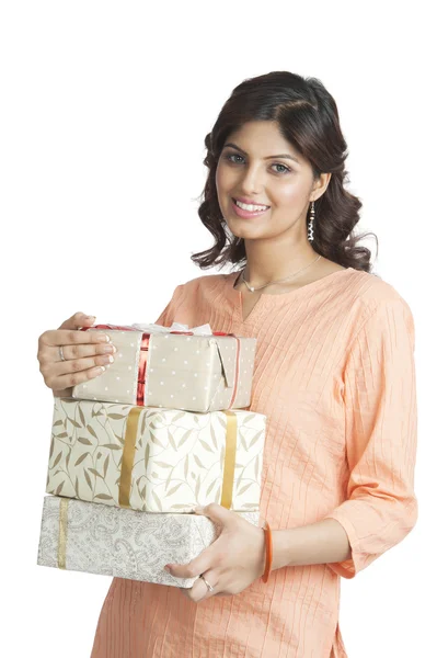 Woman holding gift boxes — Stock Photo, Image