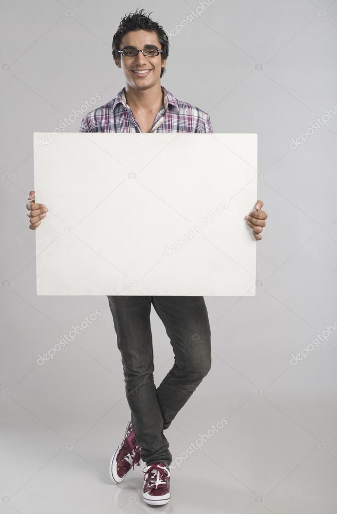 Man standing with a placard