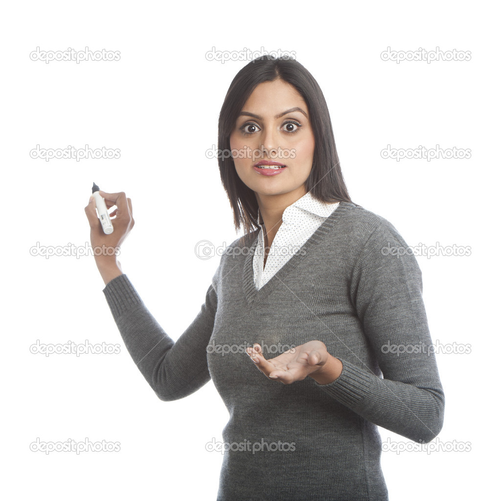 Businesswoman writing with a felt tip pen