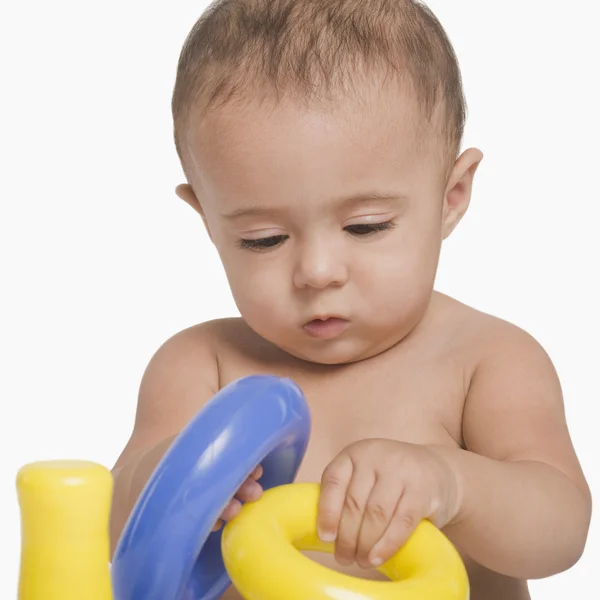 Baby boy playing with toys — Stock Photo, Image