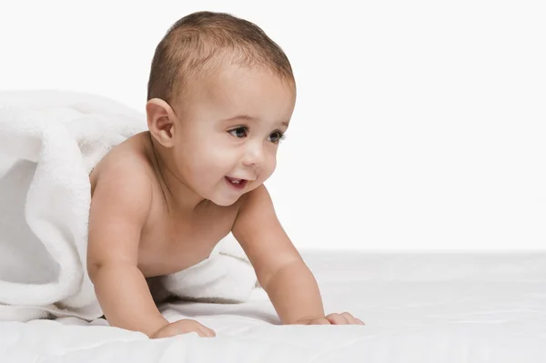 Baby boy playing with a towel — Stock Photo, Image