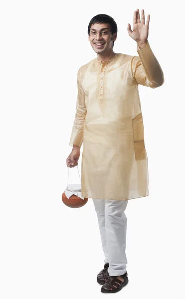 Bengali man carrying a pot of rasgulla — Stock Photo, Image