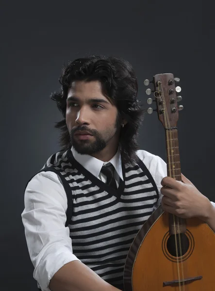 Musician holding a lute — Stock Photo, Image