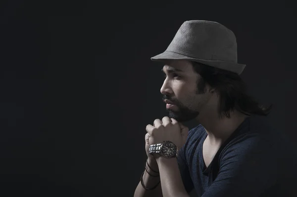 Man wearing a hat and thinking — Stock Photo, Image