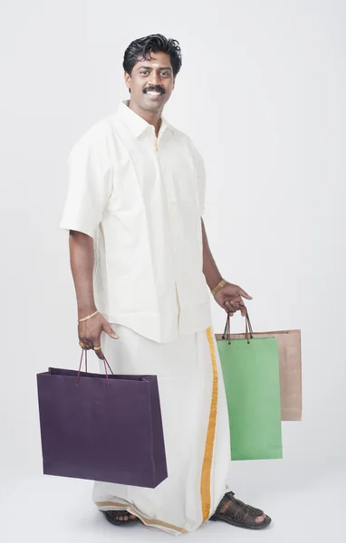 Man carrying shopping bags — Stock Photo, Image