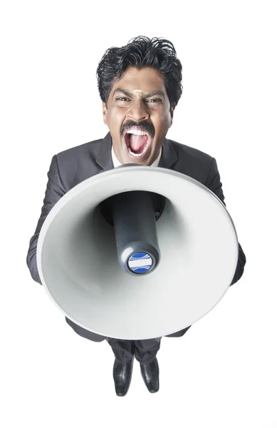Бізнесмен кричить в мегафоні — стокове фото