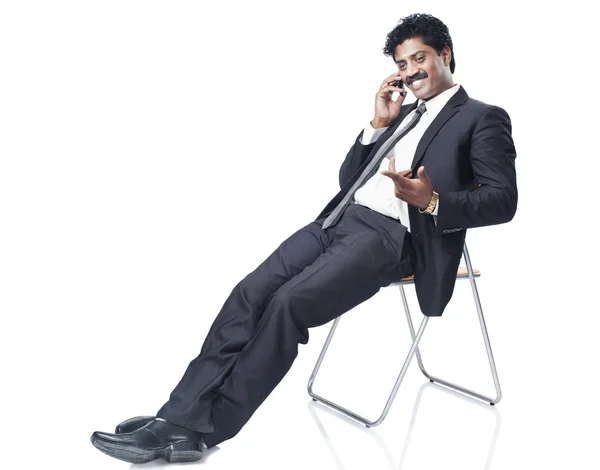 Businessman talking on a mobile phone — Stock Photo, Image