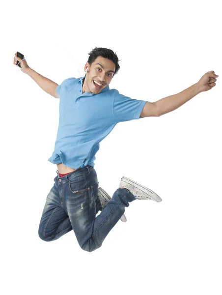 Bengali man listening to a mp3 player — Stock Photo, Image