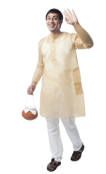 Bengali man carrying a pot of rasgulla — Stock Photo, Image