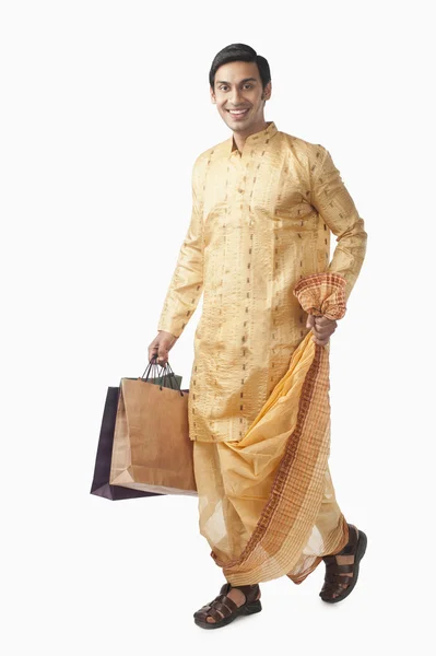 Bengali man carrying shopping bags — Stock Photo, Image