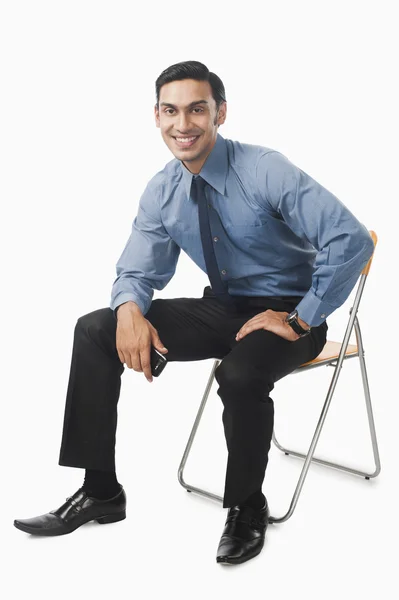 Bengálský podnikatel sedí na židli — Stock fotografie
