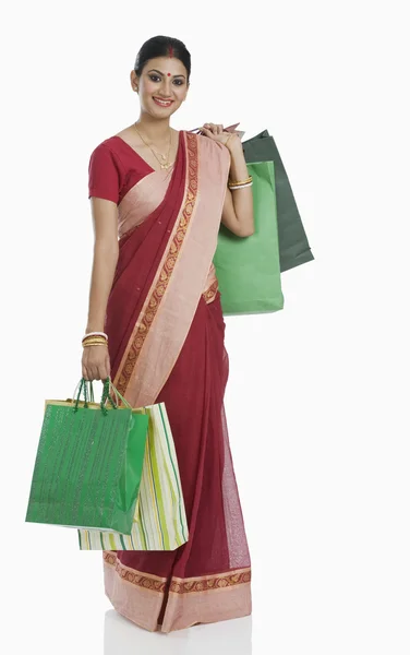 Bengali woman carrying shopping bags — Stock Photo, Image