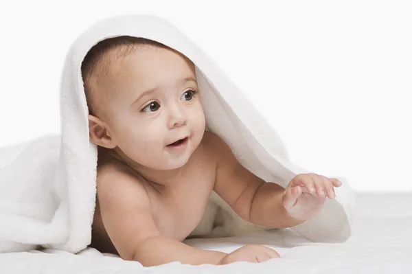 Baby boy playing with a towel — Stock Photo, Image