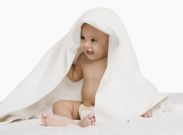 Baby boy playing with a towel — Stock Photo, Image