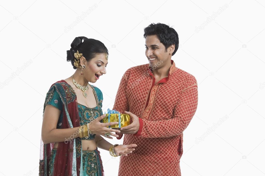 Man giving gift to his wife on Diwali