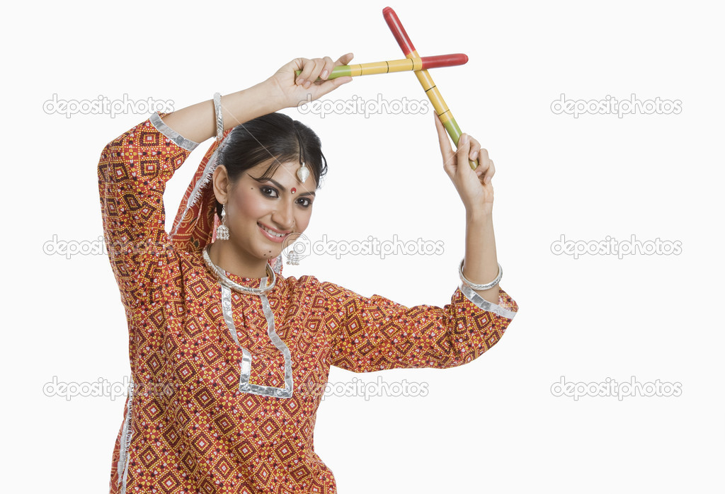 Woman performing Dandiya Raas at Navratri