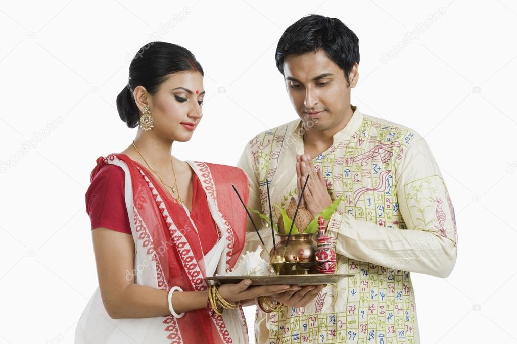 Bengali couple praying