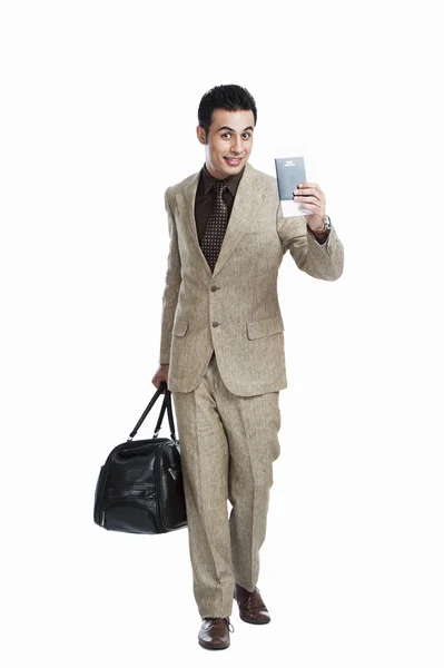 Businessman with holding passport and luggage bag — Stock Photo, Image