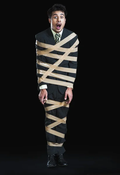 Businessman with adhesive tape — Stock Photo, Image