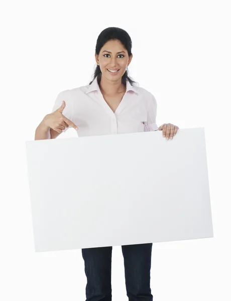 Woman holding a blank placard — Stock Photo, Image