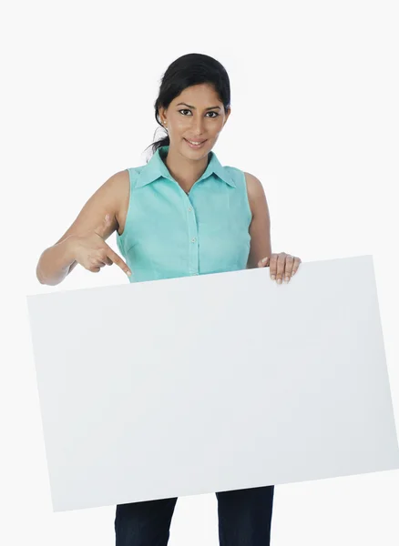 Woman holding a blank placard — Stock Photo, Image