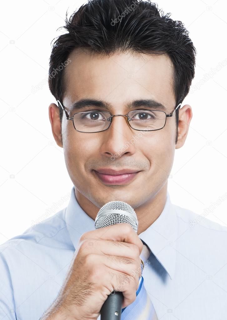 Businessman holding a microphone