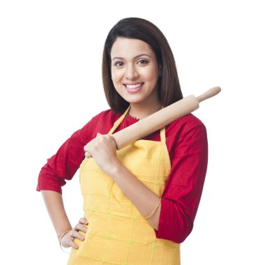 Woman holding a rolling pin clipart