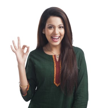 Woman showing ok sign and smiling clipart