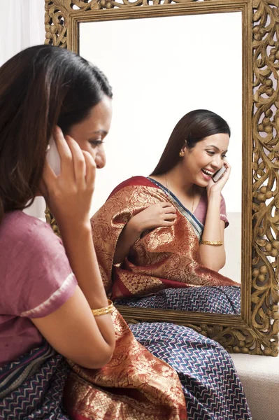 Reflection of a woman in mirror — Stock Photo, Image